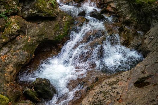 Scenic view of amazing water stream between rocks. Close up