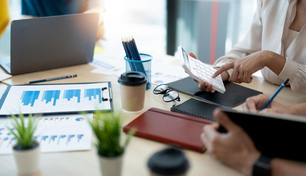 Business accountant partnership coworkers discussing a financial planning graph and company during a budget meeting in office room