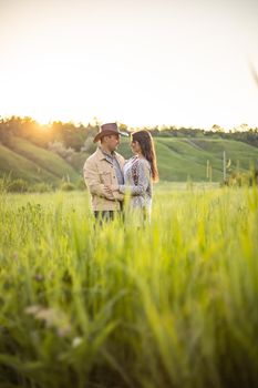 nice portrait of beautiful and young groom and bride outdoors