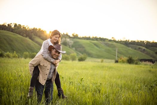 nice portrait of beautiful and young groom and bride outdoors