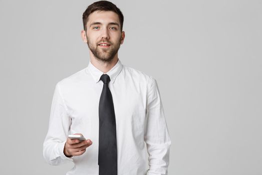 Lifestyle and Business Concept - Portrait of a handsome businessman enjoy talking with mobile phone. Isolated White background. Copy Space.