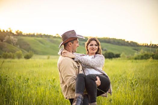 nice portrait of beautiful and young groom and bride outdoors