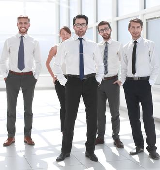 group of young employees standing in the office.the concept of professionalism