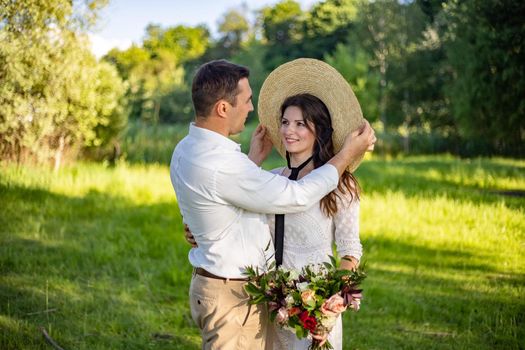 nice portrait of beautiful and young groom and bride outdoors