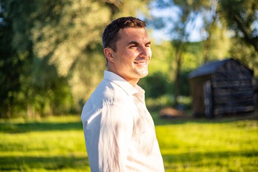 nice portrait of beautiful and young groom and bride outdoors