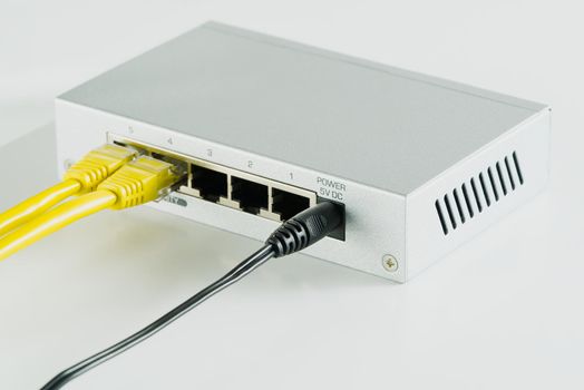 Small router and switch. tcp ip network business concept. High - performance gigabit switch. home network gray switch.