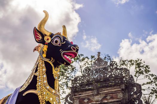 Bade cremation tower with traditional balinese sculptures of demons and flowers on central street in Ubud, Island Bali, Indonesia . Prepared for an upcoming cremation ceremony.