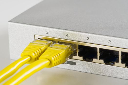 Small router and switch. tcp ip network business concept. High - performance gigabit switch. home network gray switch.