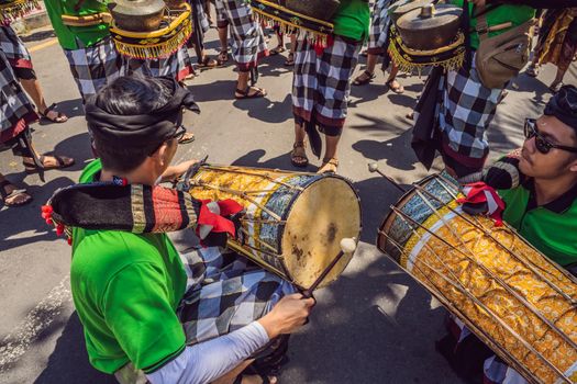 Ubud, Bali, Indonesia - April 22, 2019 : Royal cremation ceremony prepation. Balinese hindus religion procession. Bade and Lembu Black Bull symbol of transportation for the spirit to the heaven.