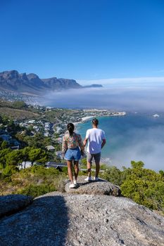 View from The Rock viewpoint in Cape Town over Campsbay, view over Camps Bay with fog over the ocean. fog coming in from the ocean at Camps Bay Cape Town South Africa