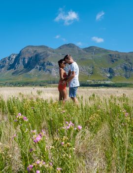 Mountains and grassland near Hermanus at the garden route Western Cape South Africa Whale coast. man and woman in grassland during a vacation in South Africa