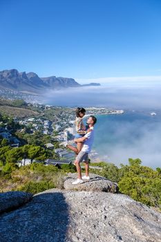 View from The Rock viewpoint in Cape Town over Campsbay, view over Camps Bay with fog over the ocean. fog coming in from the ocean at Camps Bay Cape Town South Africa