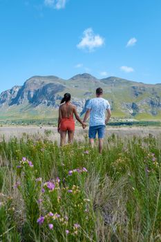 Mountains and grassland near Hermanus at the garden route Western Cape South Africa Whale coast. man and woman in grassland during a vacation in South Africa
