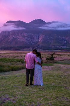 Mountains and grassland near Hermanus at the garden route Western Cape South Africa Whale coast. man and woman in grassland during a vacation in South Africa