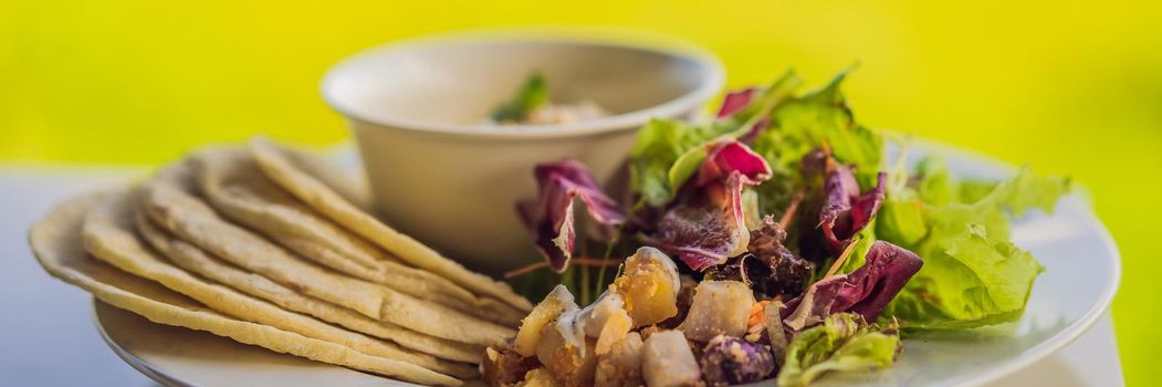 Hummus with tortillas on a white table. BANNER, LONG FORMAT