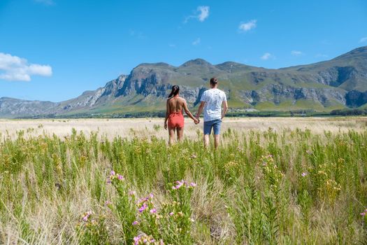 Mountains and grassland near Hermanus at the garden route Western Cape South Africa Whale coast. man and woman in grassland during a vacation in South Africa