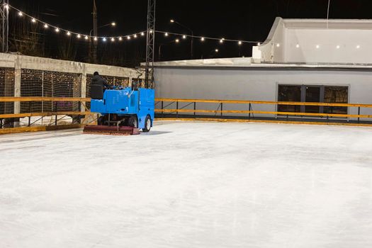 machine leveling the ice on the skating rink