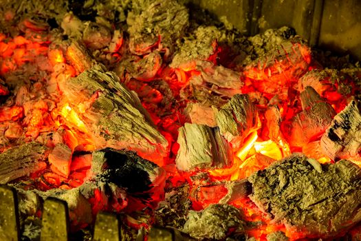 charcoals of a bonfire in a fireplace. feelings of comfort 