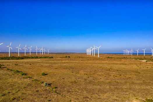 Aerial view at wind turbine farm. Horizontal view