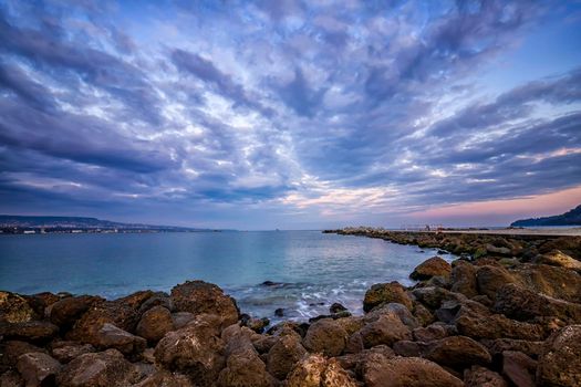 idyllic view with stunning clouds over the sea pier 