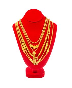 The Gold necklace on necklace display stand isolated on white background, Save Clipping path.