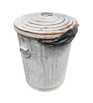 The Rusty old trash with black plastic bag can isolated on white with a clipping path.