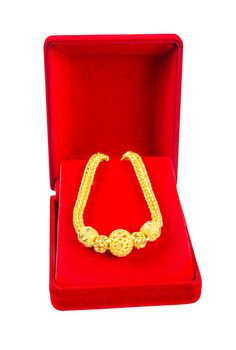 The Gold Bracelet in red velvet box isolated on white background, Save clipping path.