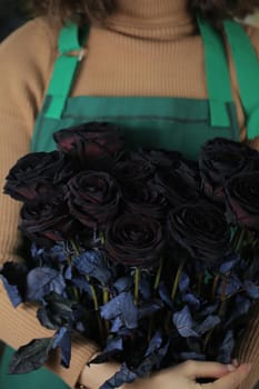 Beautiful black roses, floral background.