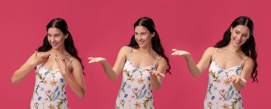 Close-up shot of a gorgeous brunette woman in a white dress with floral print, looking very happy and smiling while posing against a pink studio background. Set of a people sincere emotions. Copy space.