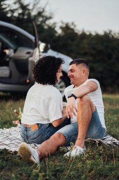 Happy Middle Aged Couple Having Picnic Outdoors, Man and Woman on Romantic Weekend