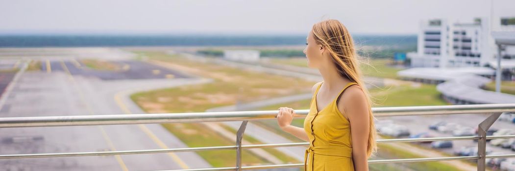 Start of her journey. Beautiful young woman ltraveler in a yellow dress and a yellow suitcase is waiting for her flight. BANNER, LONG FORMAT