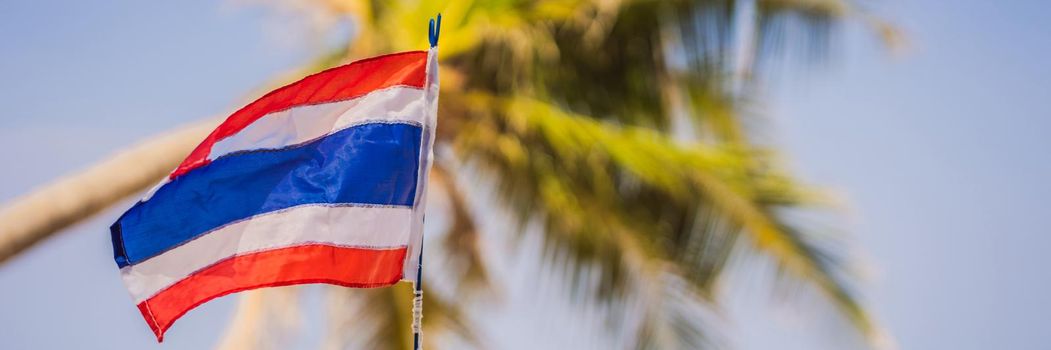 Waving Thailand flag in the sunny blue sky with summer beach background. Vacation theme, holiday concept. BANNER, LONG FORMAT