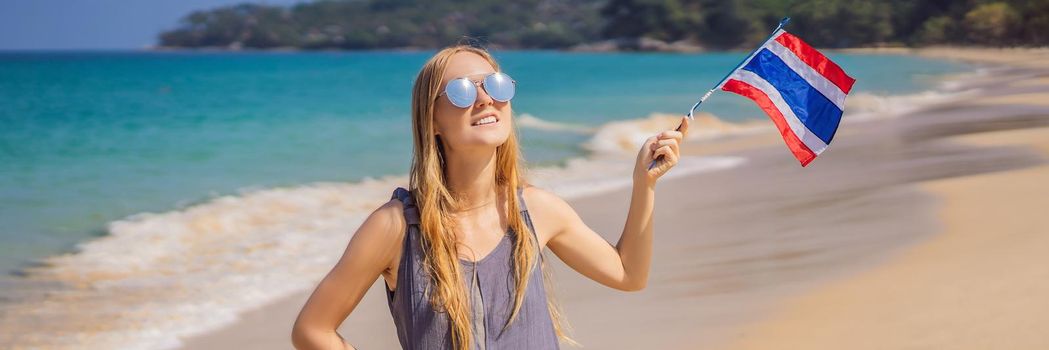 Happy woman having fun at the beach with Thailand flag. Beautiful girl enjoying travel to Asia. BANNER, LONG FORMAT