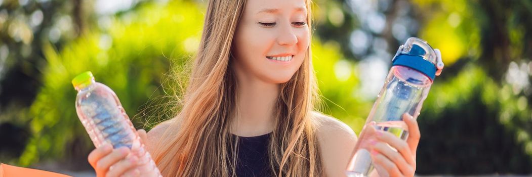 BANNER, LONG FORMAT Summer lifestyle portrait of pretty girl sitting on the orange inflatable sofa selects a disposable bottle or reusable. zero waste on the beach of tropical island. Relaxing and enjoying life on air bed.