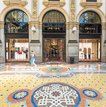 MILAN, ITALY - CIRCA SEPTEMBER 2020: Fashion shopping in Vittorio Emanuale's Gallery. People walking in front of a famous luxury boutique.
