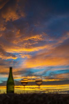 glass of wine with sunset in late summer