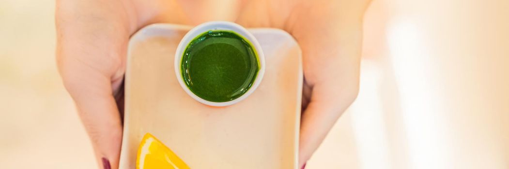 Wheatgrass shot. Juice from wheat grass. Trend of health. wheat grass. BANNER, LONG FORMAT