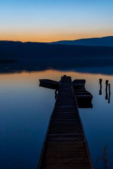 fishing boat at pier on Jenoi pond near Diosjeno, Northern Hungary