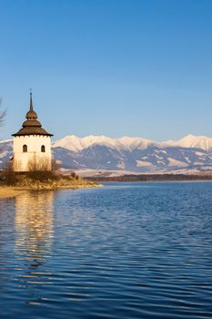 Church of Virgin Mary in Havranok and lake Liptovska Mara, district Liptovsky Mikulas, Slovakia