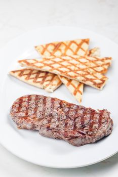beef steak with grilled pita bread
