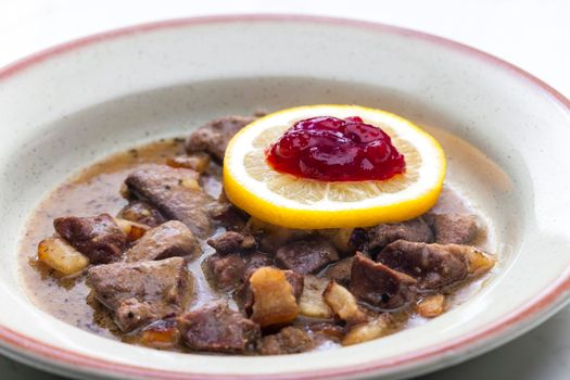 venison goulash with lemon and cranberries