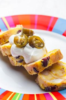 bean dumplings with sour cream and jalapenos