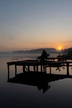 fisherman on Jenoi pond near Diosjeno, Northern Hungary