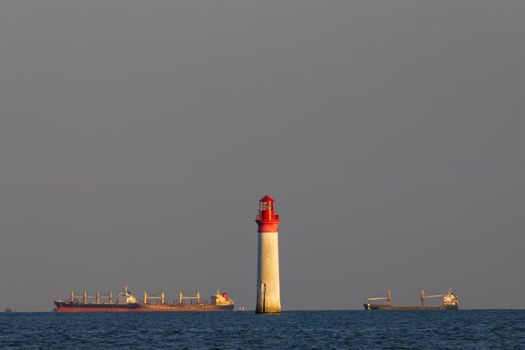 Phare de Chauvea near Ile de Re with ships to La Rochelle, Pays de la Loire, France