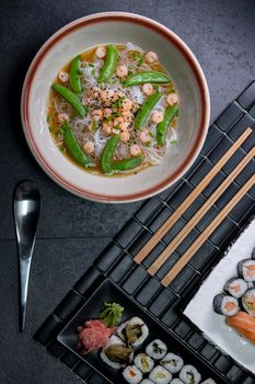 Various dishes of Asian cuisine with typical sushi