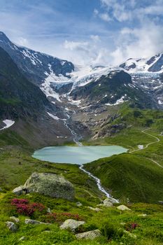 Typical alpine landscape of Swiss Alps with Steinsee, Urner Alps, Canton of Bern, Switzerland