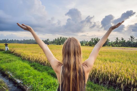 Women tourists enjoy the panoramic view of the beautiful Asian scenery of rice fields.