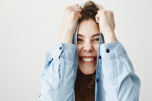 Surprised happy beautiful woman looking excitement. Isolated on gray background.