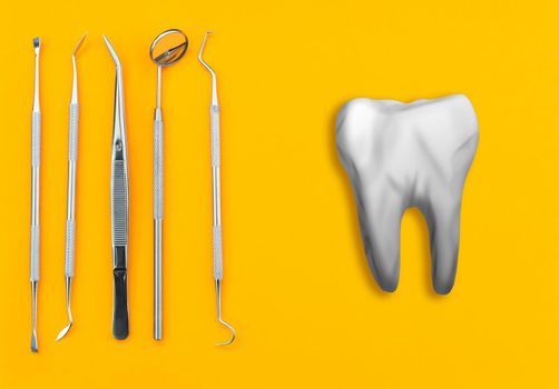 Artificial tooth and dental instrument on table. Dental services concept.