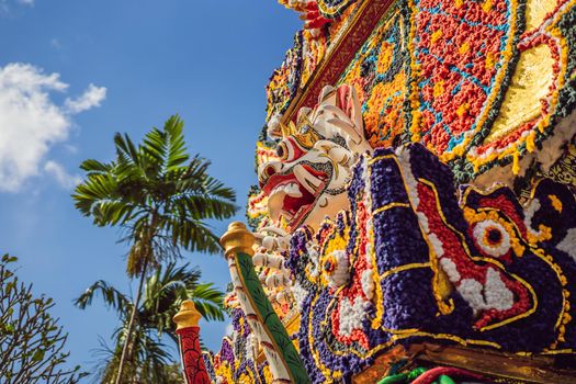 Bade cremation tower with traditional balinese sculptures of demons and flowers on central street in Ubud, Island Bali, Indonesia . Prepared for an upcoming cremation ceremony.